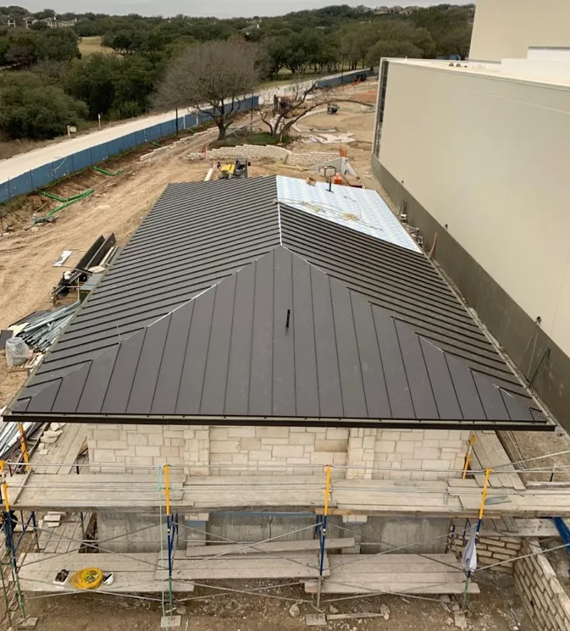 Metal roof new construction with scaffolding in Kinston